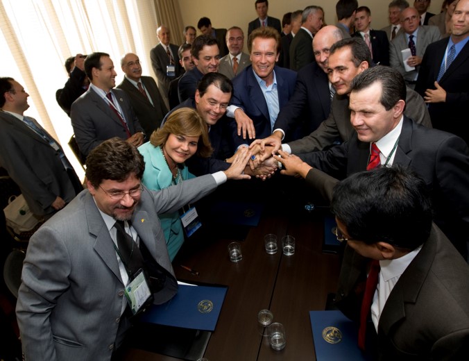 Hand stack with founding GCF Task Force governors, including Arnold Schwarzenegger.