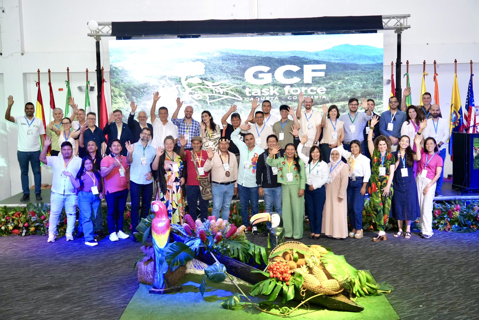 group of people on stage in front of screen that says GCF Task Force