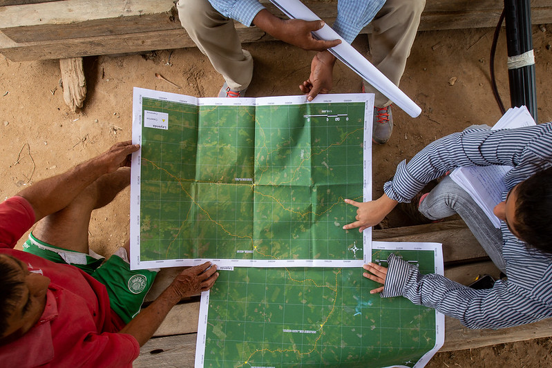 Two people examining map