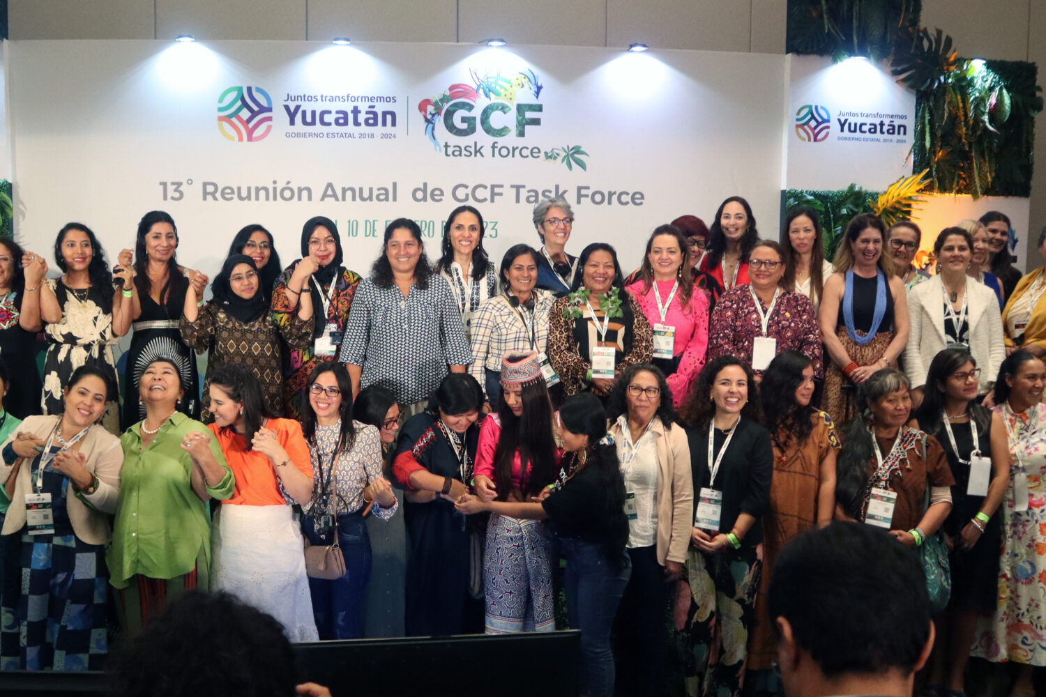 large group of women on a stage