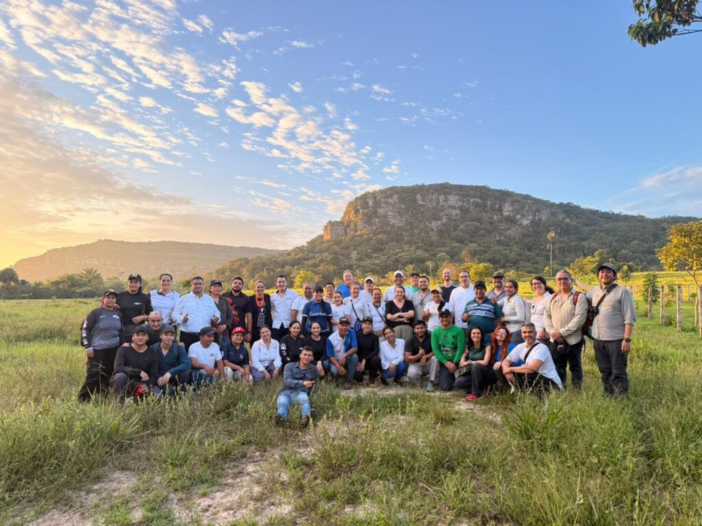 group of people in foreground, mountain in background