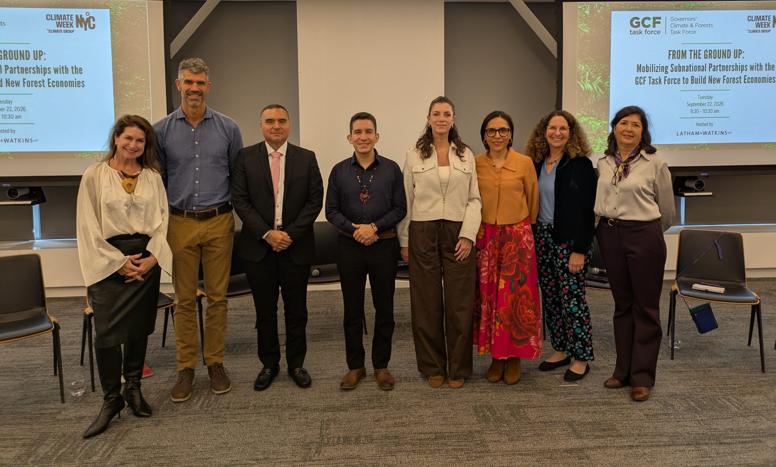 group of people in a conference room in front of a screen that says GCF Task Force - From the Ground Up: Mobilizing Subnational Partnerships with the GCF Task Force to Build New Forest Economies
